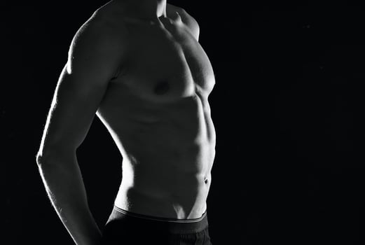 athletic man with a pumped-up body black and white photo male exercise