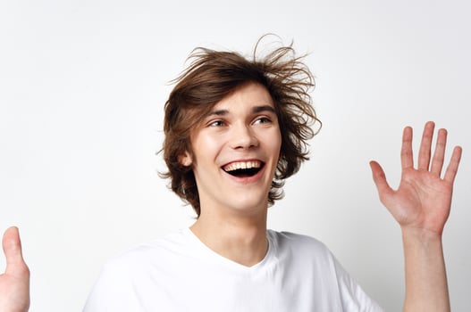 tousled hair guy white t-shirt studio lifestyle photo