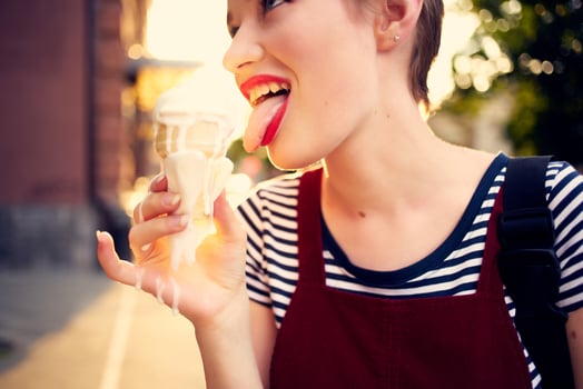 pretty woman outdoors eating ice cream Summer sun relaxation photo