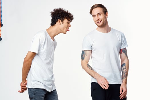 emotional men in white t-shirts antics fun isolated background photo
