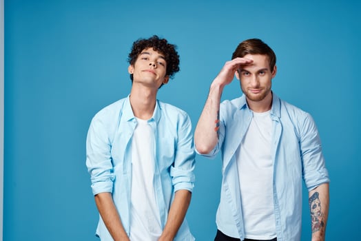 two men hold a hand near the face communication friends fun emotions photo