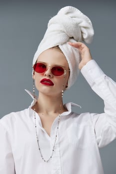 glamorous woman red glasses towel on head makeup isolated background photo