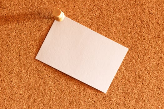 White note paper on cork board background photo