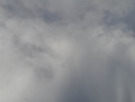 Beautiful clouds on deep blue sky background. Large bright soft fluffy clouds are cover the entire blue sky. photo