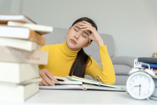 Asian student woman have anxiety because of exams, female prepare for test and learning lessons in the library. stress, despair, haste, misunderstanding reading, discouraged, expectation, knowledge photo