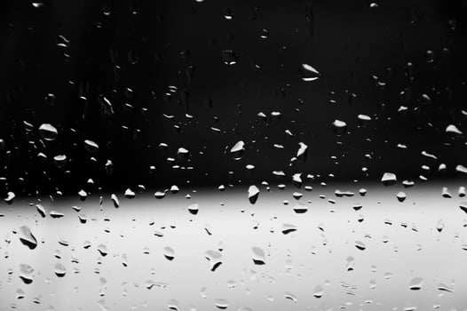 Water drops on glass texture abstract black dark background,Selective focus photo