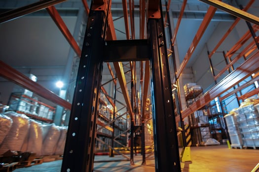 Warehouse premises of a factory or workshop with metal shelves. photo