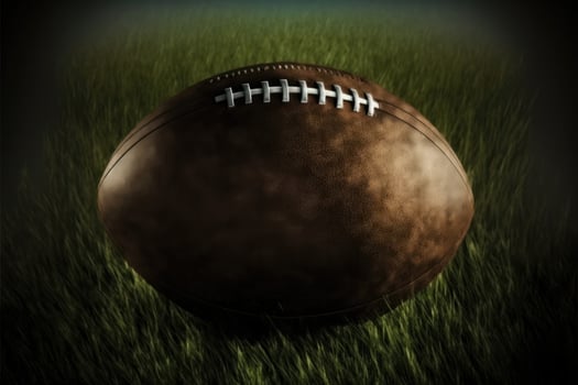 Ball of American football on the grass background. photo