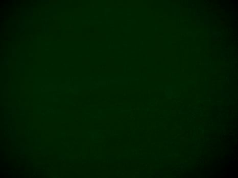 Dark green old velvet fabric texture used as background. Empty green fabric background of soft and smooth textile material. There is space for text. photo