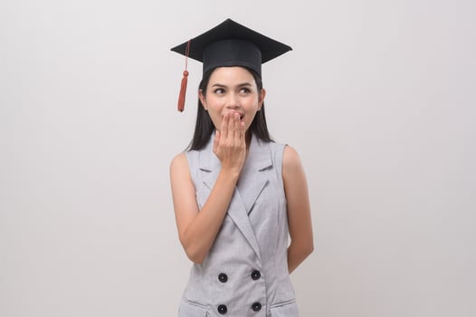 Young smiling woman wearing graduation hat, education and university concept photo