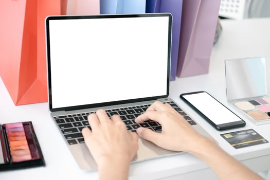 Mockup image of Beautiful woman shopping online with laptop and smartphone on online websites, mockup concept photo