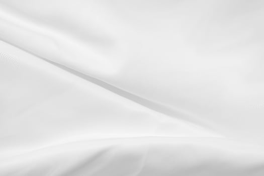 Soft focus white silk fabric texture background photo