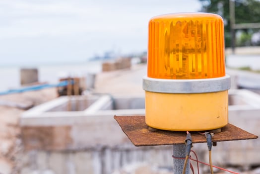 yellow siren in construction site photo