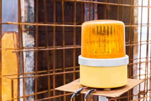 yellow siren in construction site photo