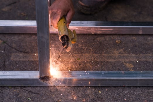Arc welding of a steel at work site photo