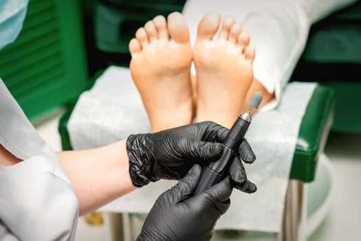 Chiropodist prepares foot file machine photo