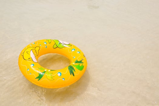 orange pool float, pool ring on the beach photo