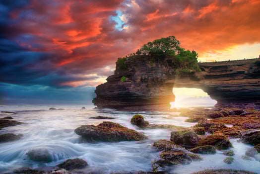 Tanah Lot Temple on sea at sunset in Bali Island, Indonesia. photo