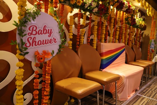 Indian baby shower decorations with balloons and flowers and chairs photo