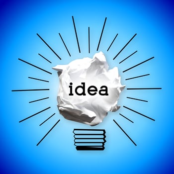 Paperball Light Bulb on Blue Background - Idea, Creativity Concept photo