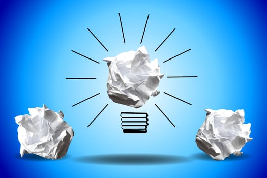 Light Bulb Icon Made with Crumpled Paper - Idea, Creativity Concept photo
