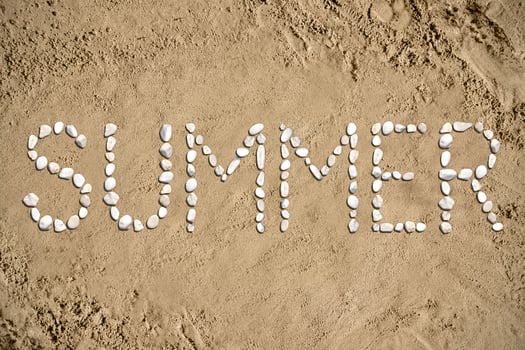 Summer - Word Made with Stones on Sand photo