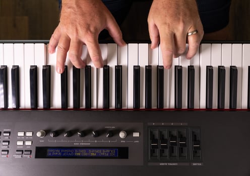 Male Hands Practicing on the Electronic Piano Keyboard. photo