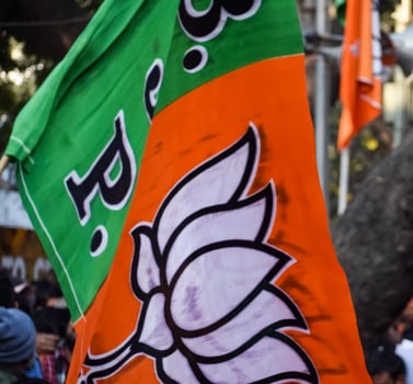 Bharatiya Janata Party Flag of Indian political party, BJP Bhartiya Janta Party Flag Waving during PM road show in Delhi, India photo