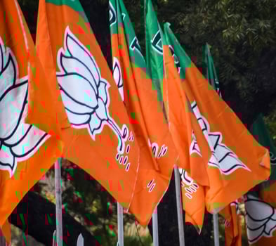 Bharatiya Janata Party Flag of Indian political party, BJP Bhartiya Janta Party Flag Waving during PM road show in Delhi, India photo