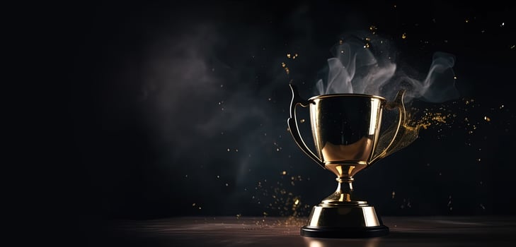 , Winner trophy with flames, golden champion cup with falling confetti on dark background photo