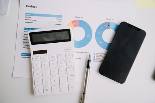 Financial analysts analyze business financial reports on a digital tablet planning investment project during a discussion at a meeting of corporate showing the results of their successful teamwork. photo
