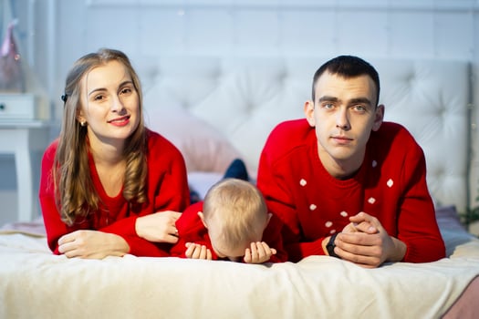 Mom dad and tired child at christmas time. photo