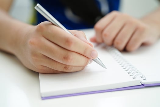 Asian teenage student write homework, study lesson for exam online learning education. photo