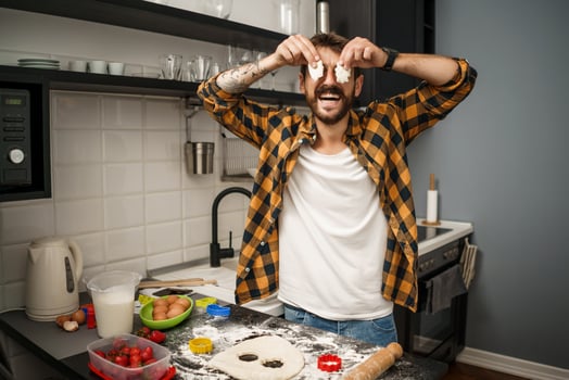 A man baking cookies in the kitchen photo