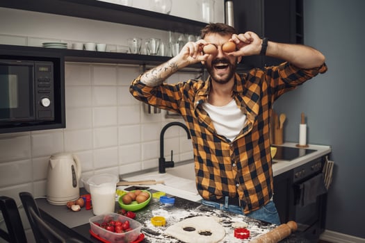 A man baking cookies in the kitchen photo