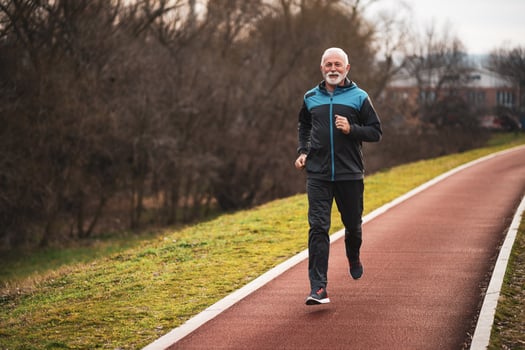 A senior man doing physical exercises photo