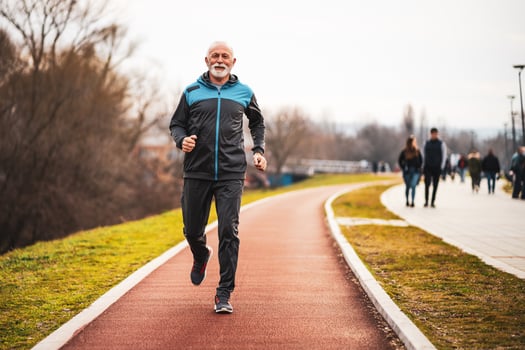 A senior man doing physical exercises photo