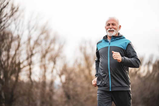 A senior man doing physical exercises photo