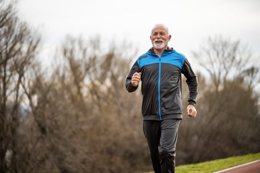 A senior man doing physical exercises photo