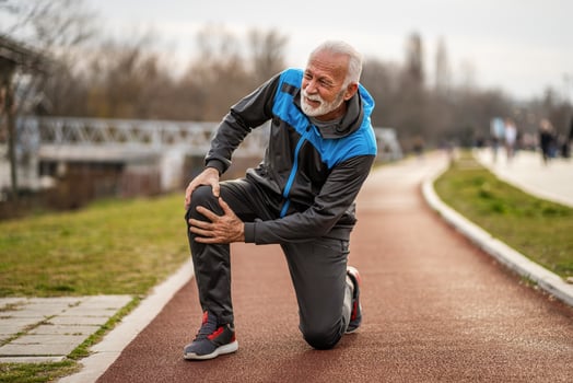 A senior man doing physical exercises photo