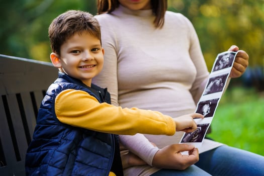 Pregnant woman and her son photo
