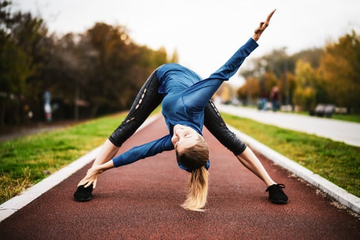A young woman doing physical exercises photo