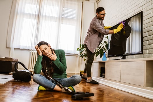 A young couple cleaning together photo