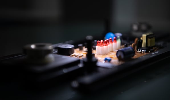 A small circuit board to be installed in a robotic hand. to serve as an intermediary for receiving and sending A set of instructions written by engineers. Let the robot hand work automatically. photo