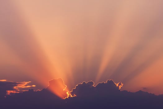 sunshine in a sky from sun hidden behind clouds photo