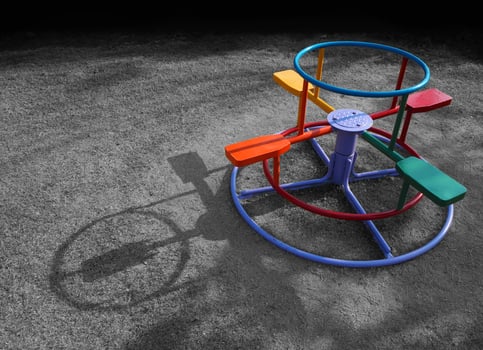 Children playground merry-go-round in the park photo