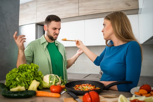A young couple cooking together photo
