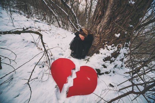 Heartbroken young blonde woman on the forest photo