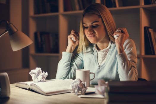 Tired college girl studying late night at home photo