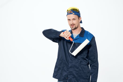 man in working uniform repair painting decorator photo